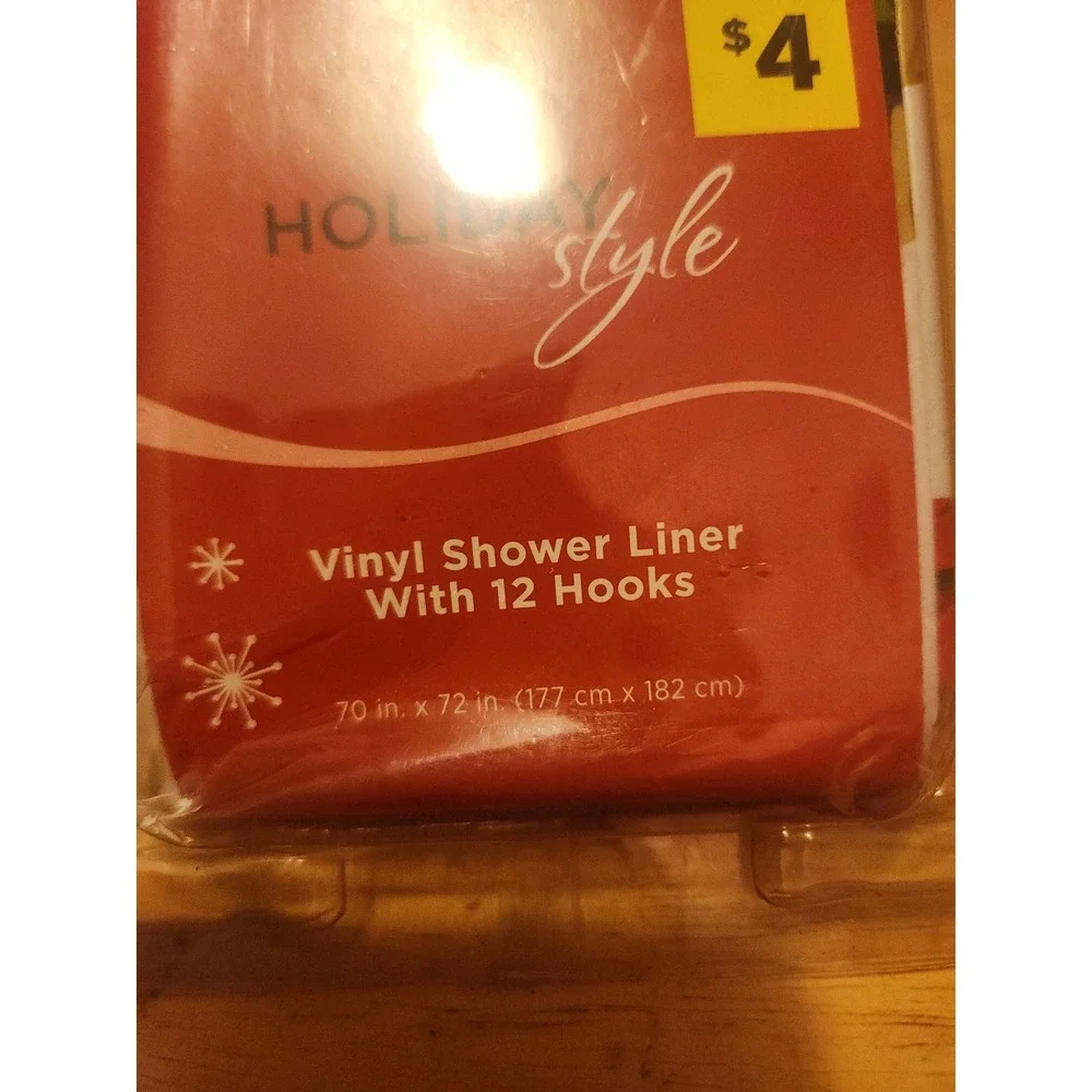 Poinsettia shower curtain with hooks, possibly vintage